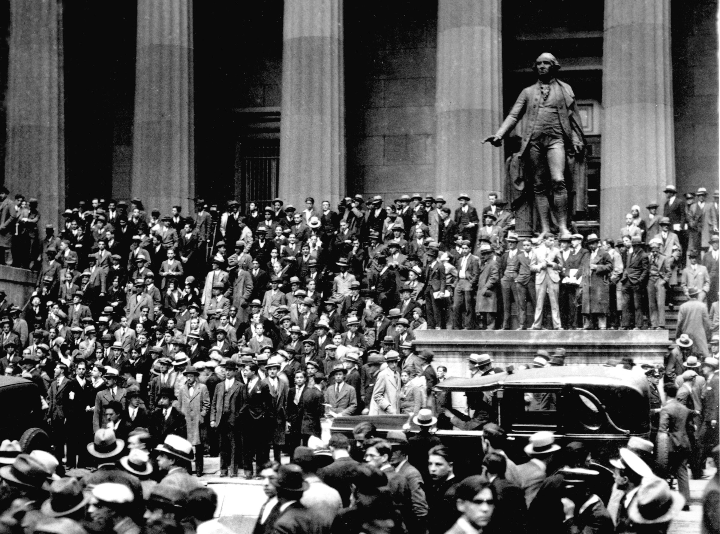 Crowds gathering outside the New York Stock Exchange on Black Thursday, October 24, 1929 — the archetypal image of financial default panic