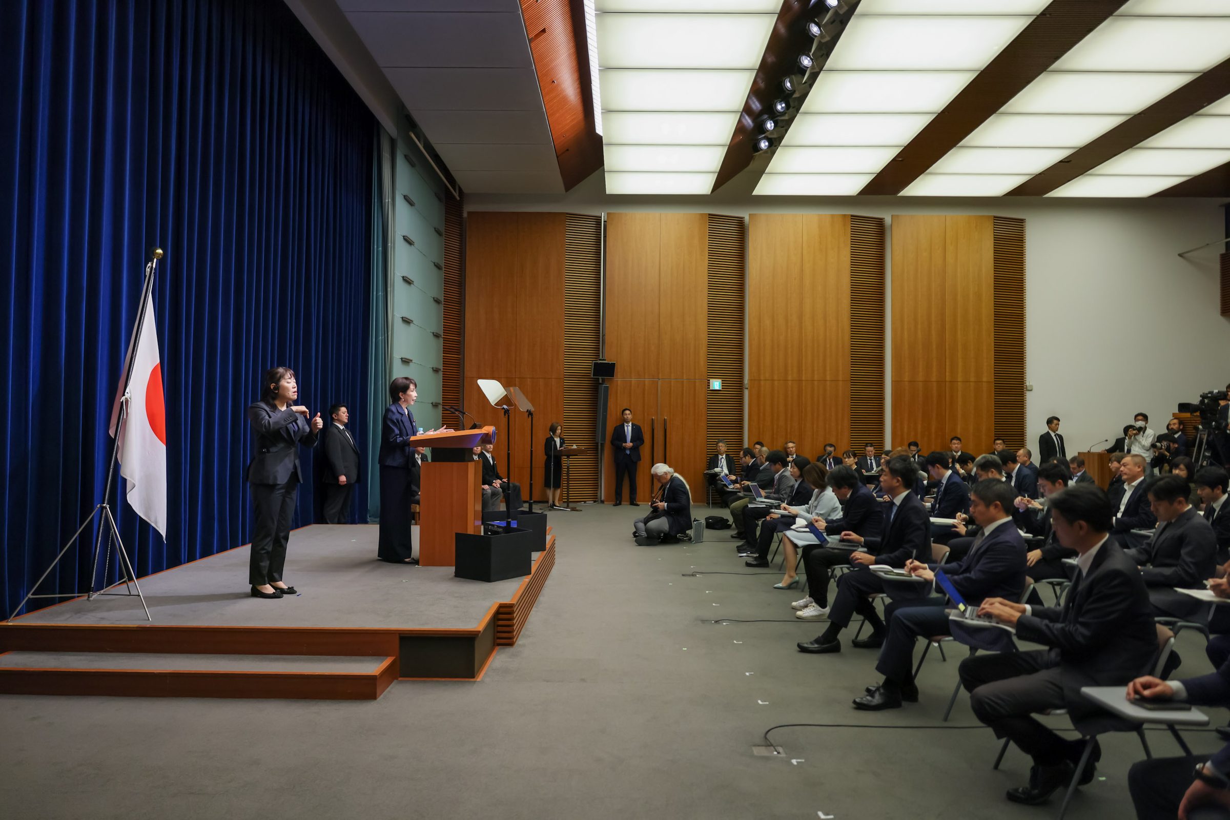 Japanese Prime Minister Sanae Takaichi at a Kantei press conference — the government narrative surface